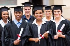 portrait of multiracial graduates holding diploma